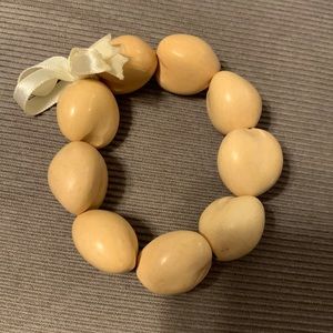 Vintage Hawaii Kukui nut elastic bracelet w ribbon.